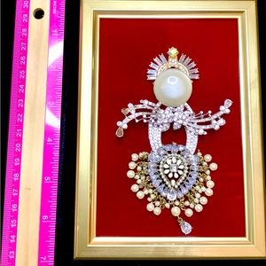 Angel Pamela, is zirconia, silver and pearl on red velvet in gold frame 5 x 7